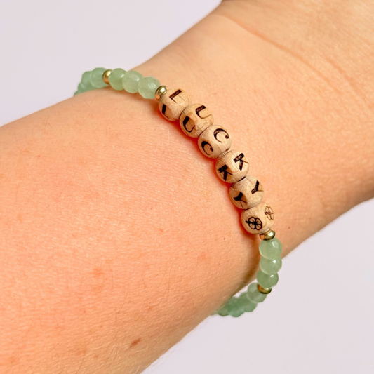 Bracelet featuring 5mm engraved wooden beads which you can personalise with your choice of words, numbers and symbols. The main the band of the bracelet is made with 4mm faceted green aventurine round crystal gemstone beads. Finished with your choice of gold vermeil, sterling silver or rose gold vermeil accent beads.