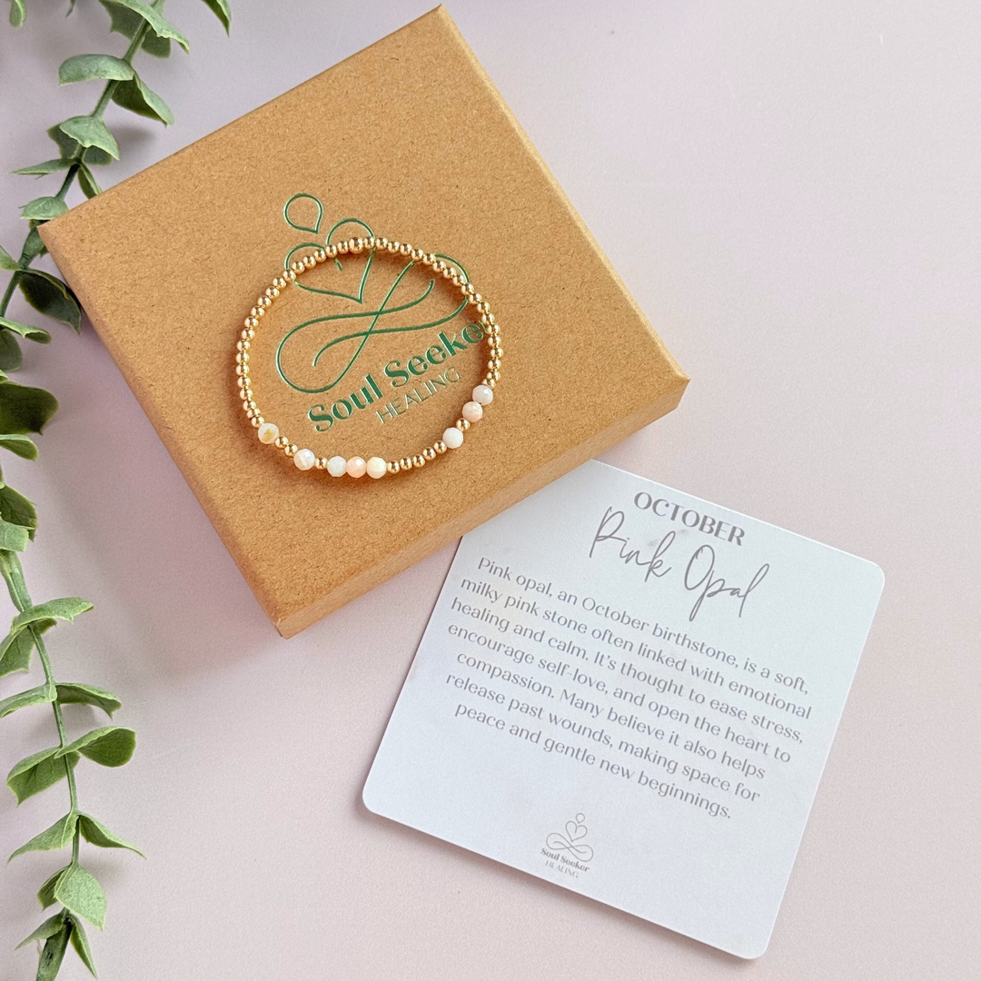 Morse code secret message bracelet spelling out your chosen name in gold filled and pink opal crystal beads. Elasticated with 4mm faceted pink opal beads and 3mm gold filled beads. Custom October birthstone bracelet.