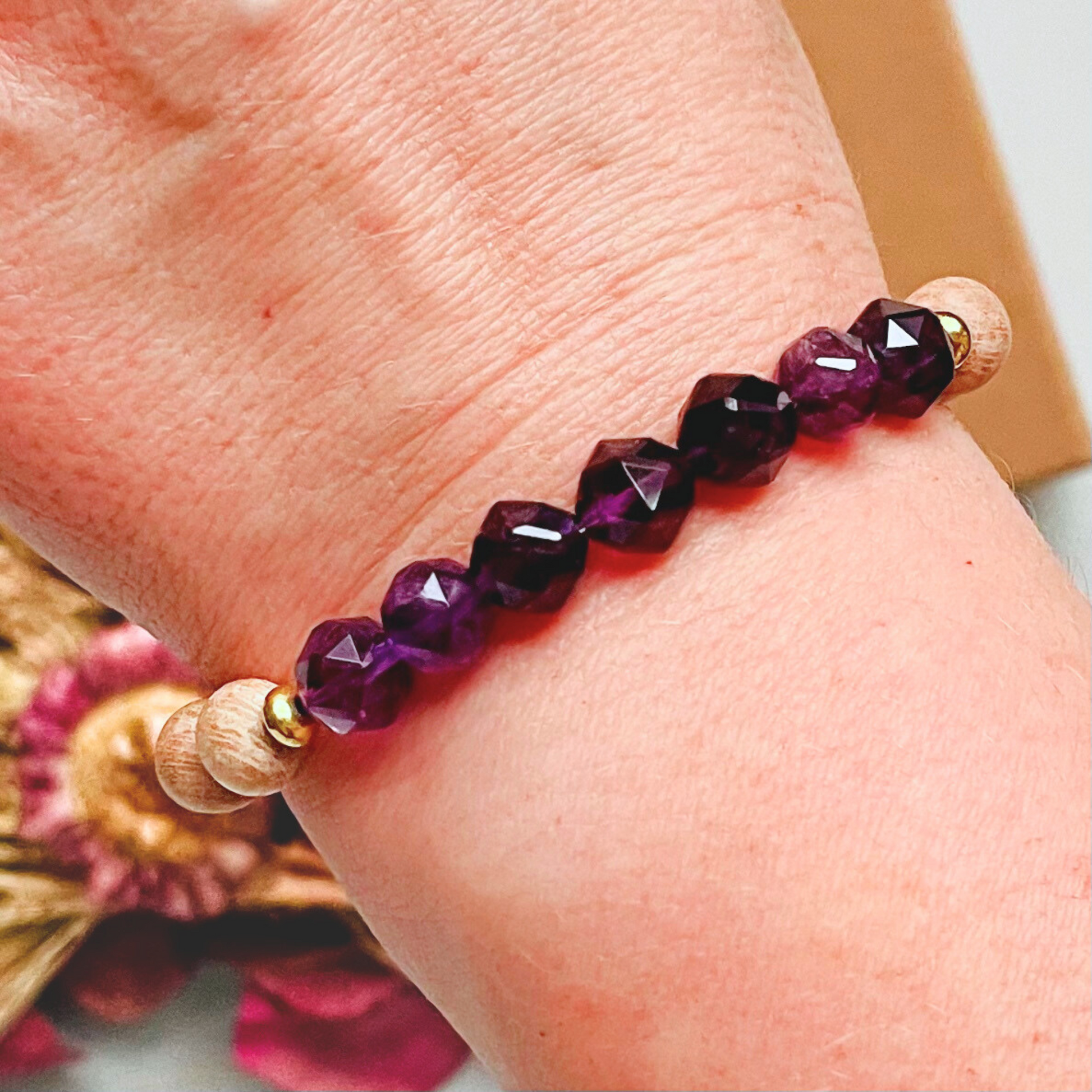 Amethyst and raw rosewood elasticated essential oil diffuser bracelet. Made with 8mm star cut amethyst beads, 8mm round raw rosewood beads and your choice of sterling silver, gold vermeil or rose gold vermeil spacer beads
