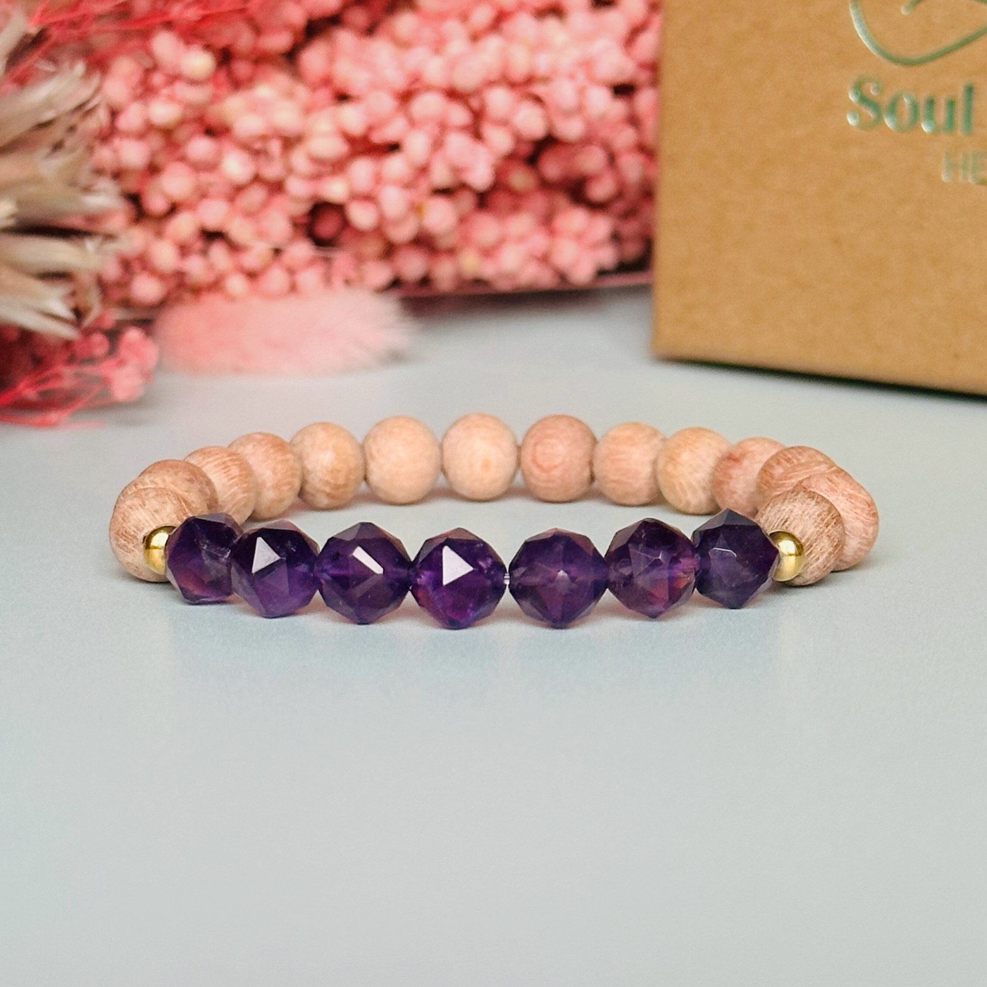 Amethyst and raw rosewood elasticated essential oil diffuser bracelet. Made with 8mm star cut amethyst beads, 8mm round raw rosewood beads and your choice of sterling silver, gold vermeil or rose gold vermeil spacer beads
