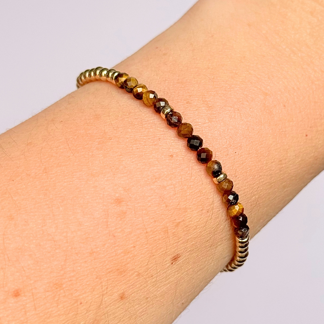 Dainty minimalist yellow gold filled crystal bracelet featuring 3mm faceted tigers eye beads with 3mm gold filled beads. Fastens with a gold filled lobster clasp with an extender chain.